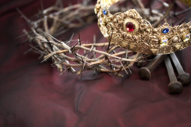 istock Crown of Thorns and a Gold Crown on an Red Background 1296440864