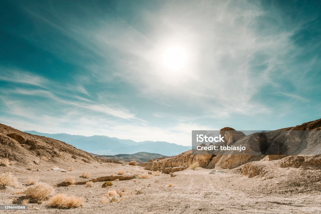 Death Valley Death Valley is a desert valley located in Eastern California. It is the lowest, driest, and hottest area in North America. Desert Area Stock Photo
