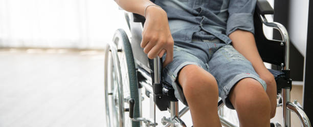 Disability polio patient sitting on wheelchair in hospital, Banner with copy space stock photo