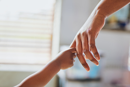 Shot of an unrecognisable little girl holding her mother’s hand