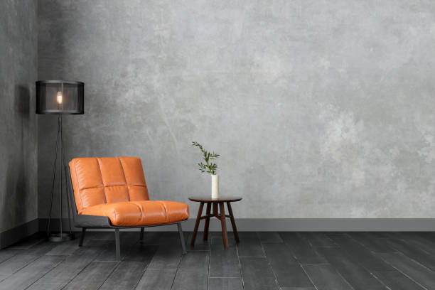 interior moderno con sillón de cuero de color naranja, escote, mesa de centro y pared gris. - mesa mueble fotografías e imágenes de stock