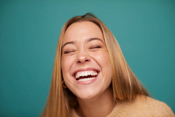 istock Beautiful young woman laughing out loud. 1296445580
