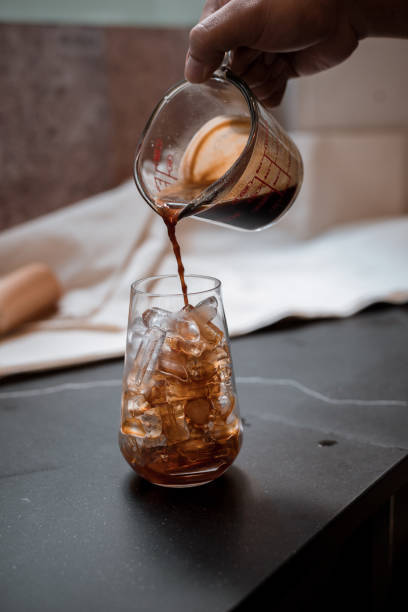 istock Glass of coffee on the table 1296445691