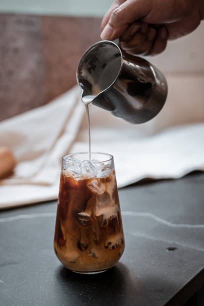 istock Glass of coffee on the table 1296446389
