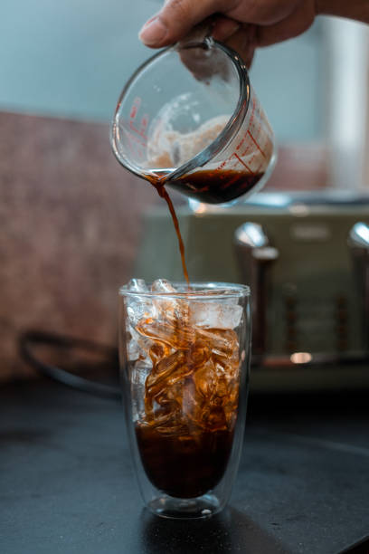 istock Glass of coffee on the table 1296446395