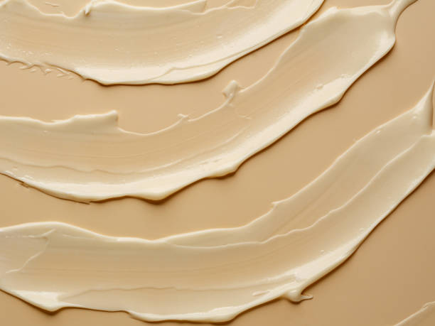 istock texture of nude cream on beige background. 1296446551