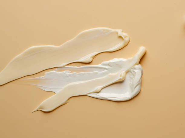istock texture of nude cream on beige background. 1296446564
