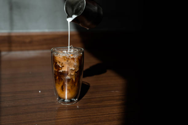 istock Glass of coffee on the table 1296447292