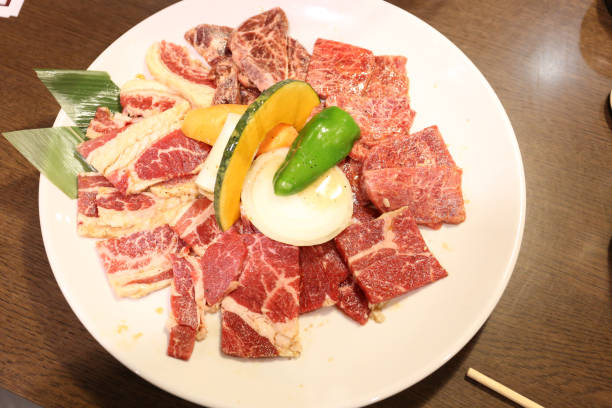 istock Raw Japanese beef on white dish and wood table 1296447455