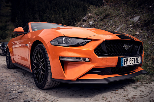 Pralognan - France - August 25, 2020 : Ford Mustang GT Orange Fury