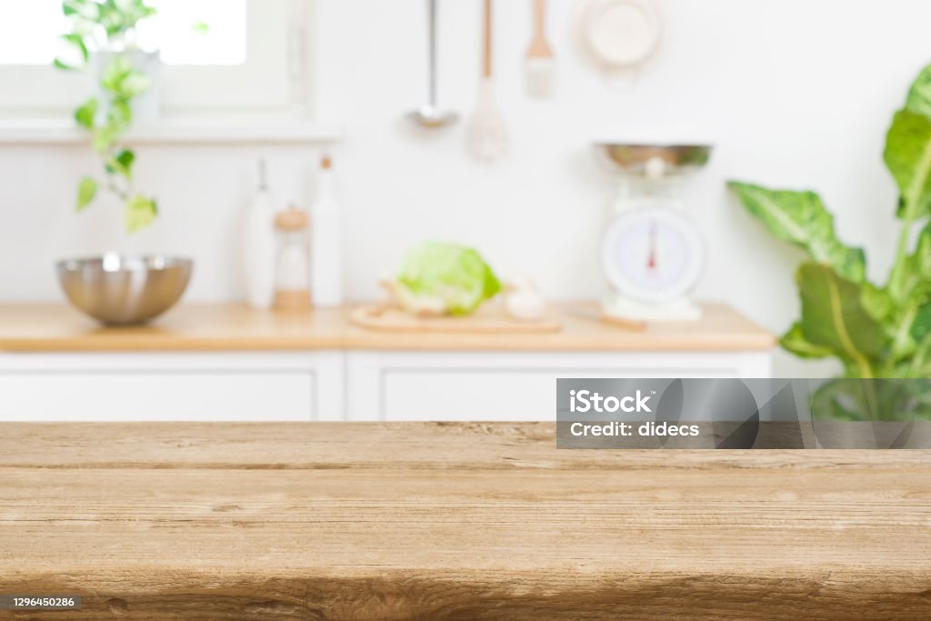 Wood table top on blur kitchen room counter background Kitchen Stock Photo