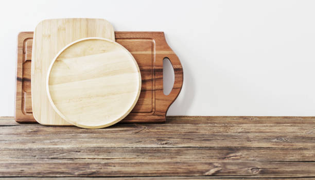 istock cutting board on wooden table on background white wall 1296450354