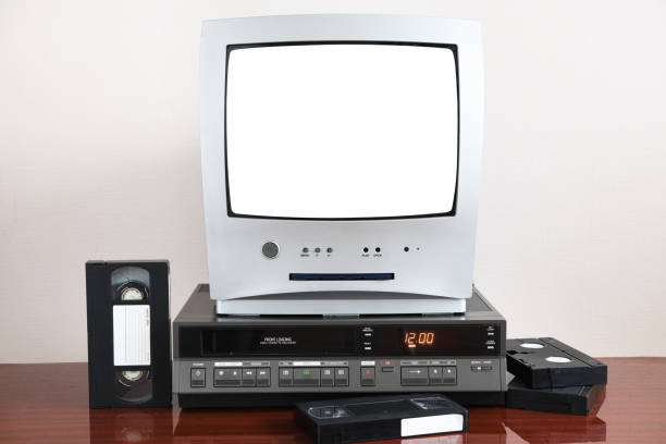 Old silver TV with white isolated screen with built-in DVD player and vintage video recorder from 1980s, 1990s, 2000s. Old silver TV with white isolated screen with built-in DVD player and vintage video recorder from 1980s, 1990s, 2000s. dvd player stock pictures, royalty-free photos & images