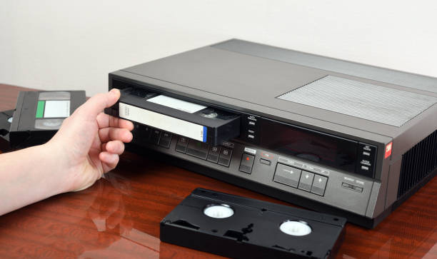 istock VHS videocassette is put into the video recorder to watch the video, another video cassette is on the video-tape recorder 1296450607