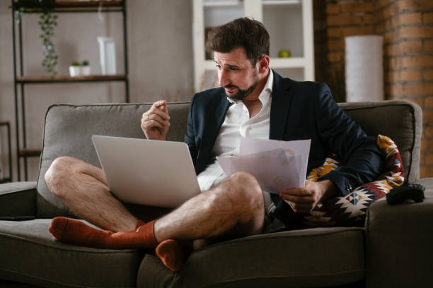istock Businessman working online, wearing suit and no pants. 1296450670