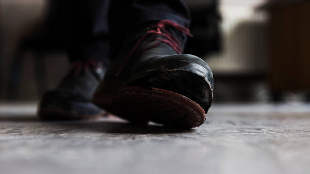 istock Old boot with an open sole in close up central perspective image. 1296450703