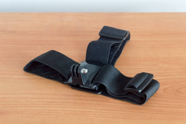 istock Head mount action cam accessories on wooden table. 1296453122