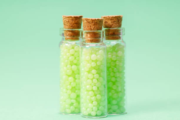 glass bottles with corks with green granules