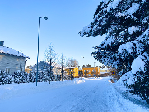 This is small conurbation named Ylästö in Finland and located in City of Vantaa. It is about 5 km from Airport. This is shot on January 2021 when it was -21 C weather. This is typical view in Vantaa area with town houses and terraced houses.