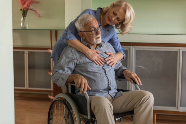 istock Disabled Man is Enjoying the Time with his Wife While at Home. 1296462612