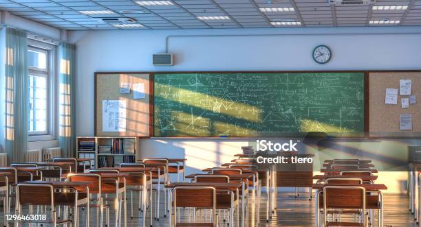 Interior Of A School Classroom With Wooden Desks And Chairs Stock Photo - Download Image Now