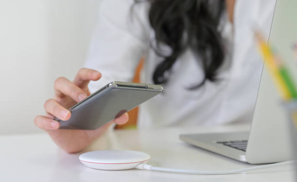 istock Place the smartphone on the wireless charger. 1296463789