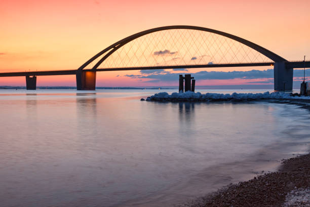 istock Fehmarn Sound Bridge at dusk 1296464834