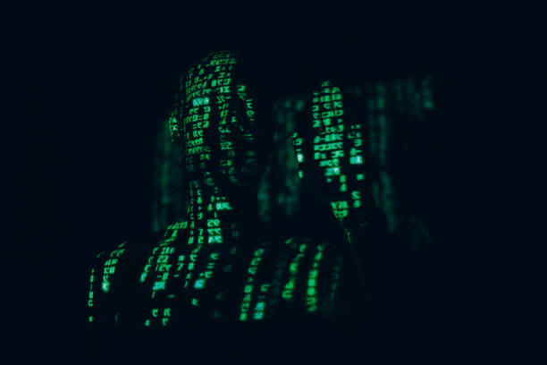 istock Young man with geen abstract letters on his face in the dark. 1296465191