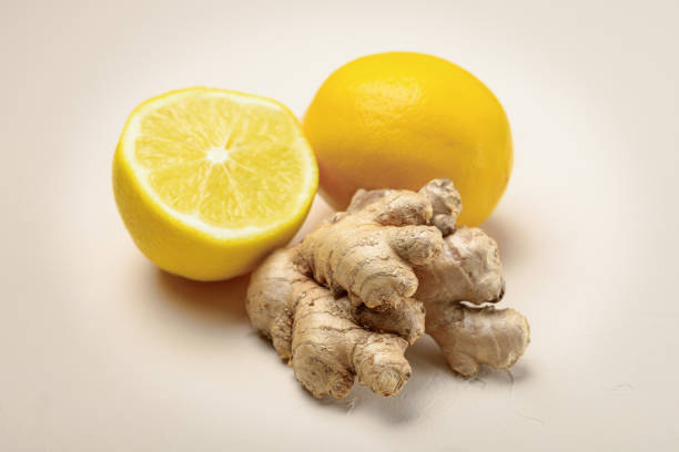 istock Close-up of ginger and lemon on a light beige background 1296465877