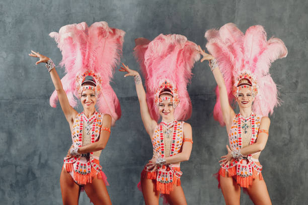 istock Three Women in samba or lambada costume with pink feathers plumage 1296466113