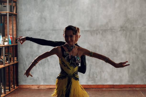 istock Young couple dancers dancing ballroom dance cha-cha-cha. 1296466161
