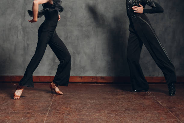 istock Young couple dancing in ballroom dance cha-cha-cha. 1296466166