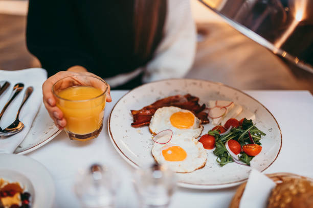 istock Young woman having breakfast at bedroom 1296466398