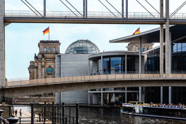Berlin, Germany - July 30, 2019: Scenic view of Government District along Spree river with Reichstag, Marie-Elisabeth-Luders-Haus and Paul Loebe buildings