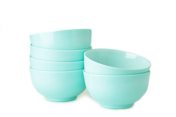 istock Set of stacked mint ceramic salad plates isolated on white background. 1296473416
