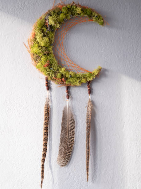 istock Green dream catcher made of feathers and beads 1296474859