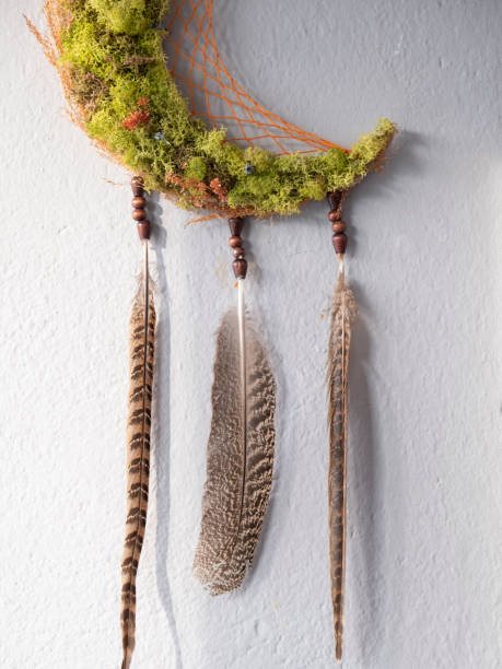 istock Green dream catcher made of feathers and beads 1296474906