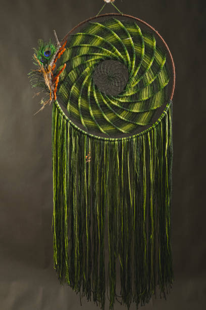 istock Dream catcher made with green thread and beads 1296477144