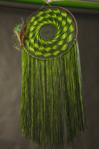 istock Dream catcher made with green thread and beads 1296477454