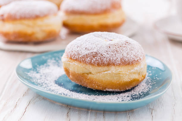 istock Traditional German Krapfen, Berliner or donuts with icing sugar 1296478061