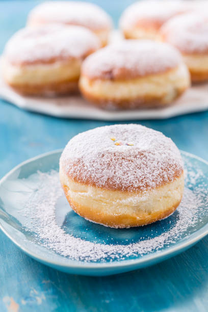 istock Traditional German Krapfen, Berliner or donuts with icing sugar 1296478066