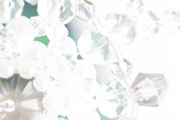 Background of abstract glittering lights. Blurred crystal beads for the background. de-focus. Use it as a background for your presentation.