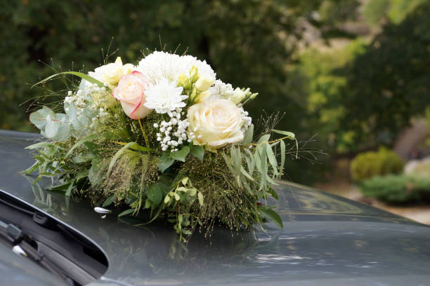 istock wedding bouquet on a gray car hood 1296484976