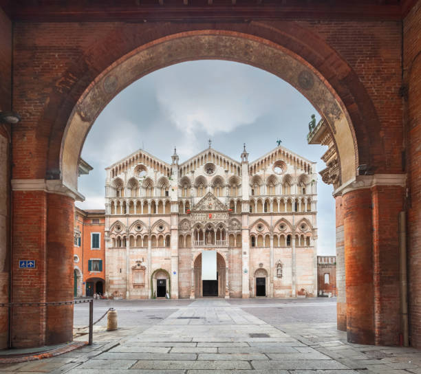 Cathedral in Ferrara, Italy Ferrara, Italy. View of Cathedral through the arch (HDR-image) emilia romagna photos stock pictures, royalty-free photos & images