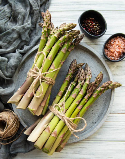 istock Bunch of raw asparagus stems 1296485534