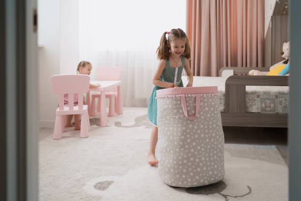 Lovely little girl playing in their room stock photo