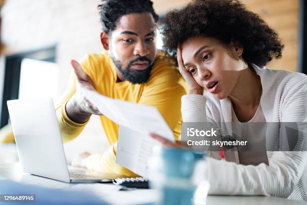 Young Black Couple Having Problems With Online Banking At Home Stock Photo - Download Image Now