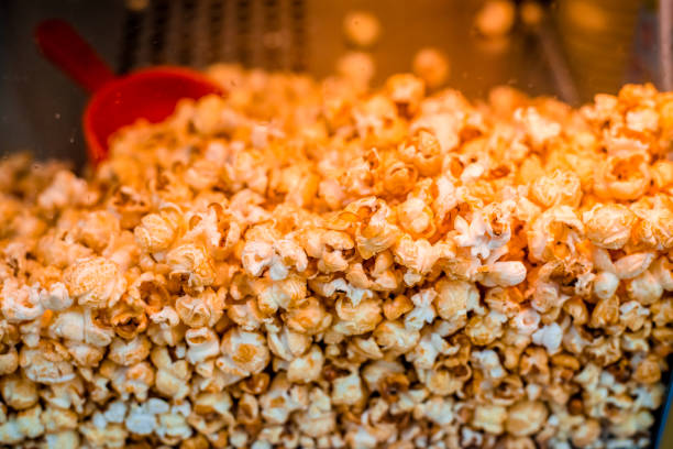 istock Sweet popcorn shop close up view 1296489848