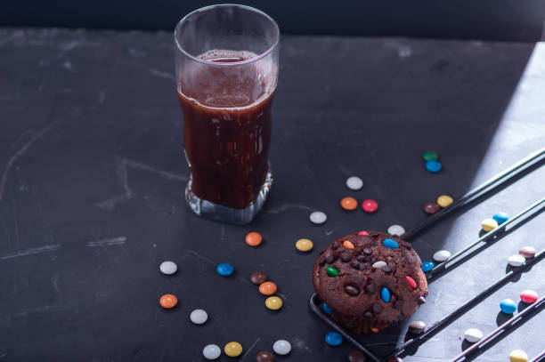 istock Hot chocolate and chocolate muffin. Cocoa and muffin. Chocolate multicolored sweets. 1296491000