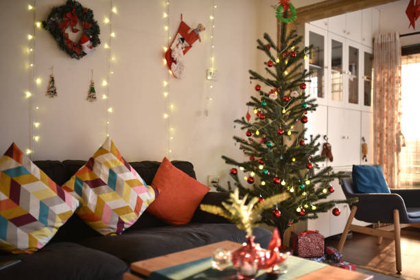 istock Living room decorated for Christmas with Christmas tree and string lights 1296491129